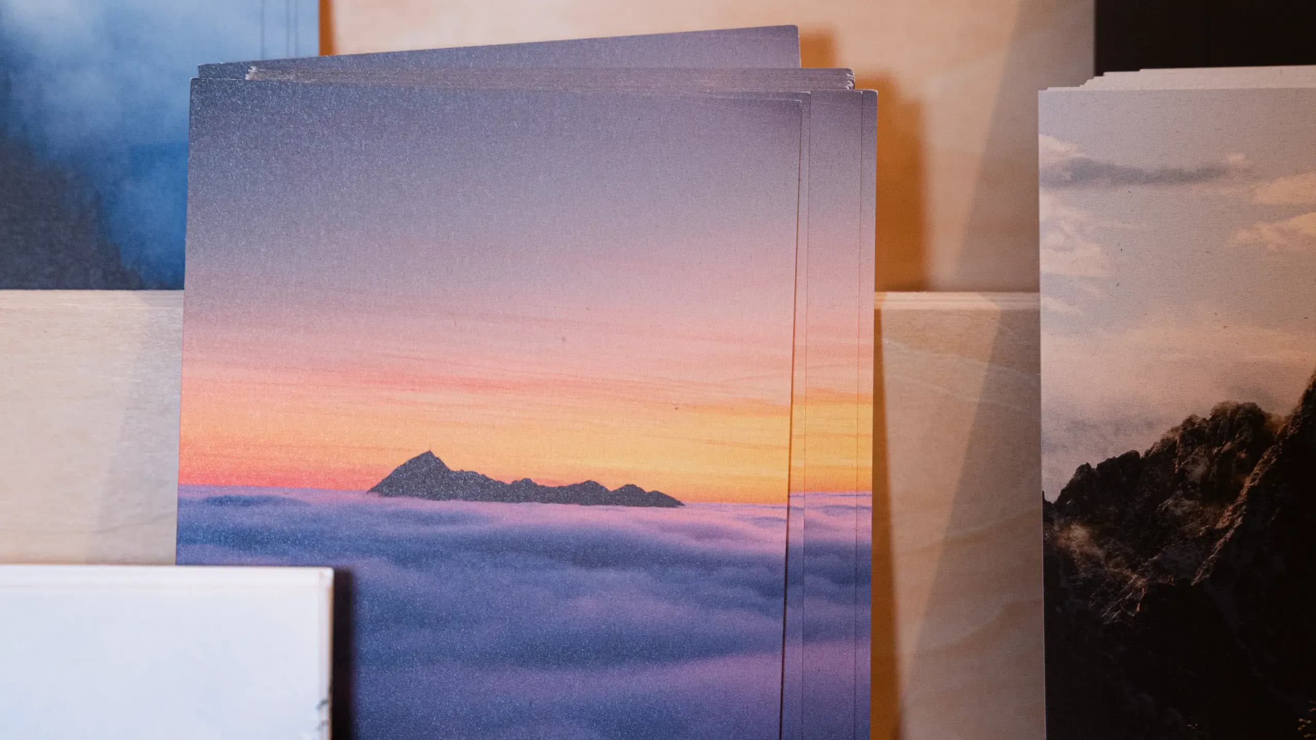 Closeup of postcard displaying a sunset